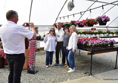 Marco Laan of Hem Genetics taking a picture of visitors in front of the Hem Genetics varieties.